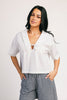 a vintage-inspired short sleeve white top with a relaxed fit + lace trim collar. the perfect elevated basic to dress up or down for any spring + summer outfit idea.