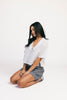a vintage-inspired short sleeve white top with a relaxed fit + lace trim collar. the perfect elevated basic to dress up or down for any spring + summer outfit idea.