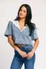 a short sleeve denim top with an oversized lace collar + a cropped silhouette. the perfect button up denim top to dress up or down for any outfit idea.
