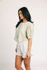 a vintage-inspired puff sleeve top with a pastel green pinstripe pattern + an oversized lace trim collar. the perfect elevated button up top for the office, dressy date nights, + everyday wear.
