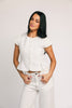 a white denim short sleeve top with a fitted silhouette + a peplum hemline. the perfect denim top to dress up or down for any outfit idea.
