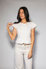 a white denim short sleeve top with a fitted silhouette + a peplum hemline. the perfect denim top to dress up or down for any outfit idea.
