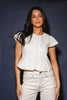 a white denim short sleeve top with a fitted silhouette + a peplum hemline. the perfect denim top to dress up or down for any outfit idea.
