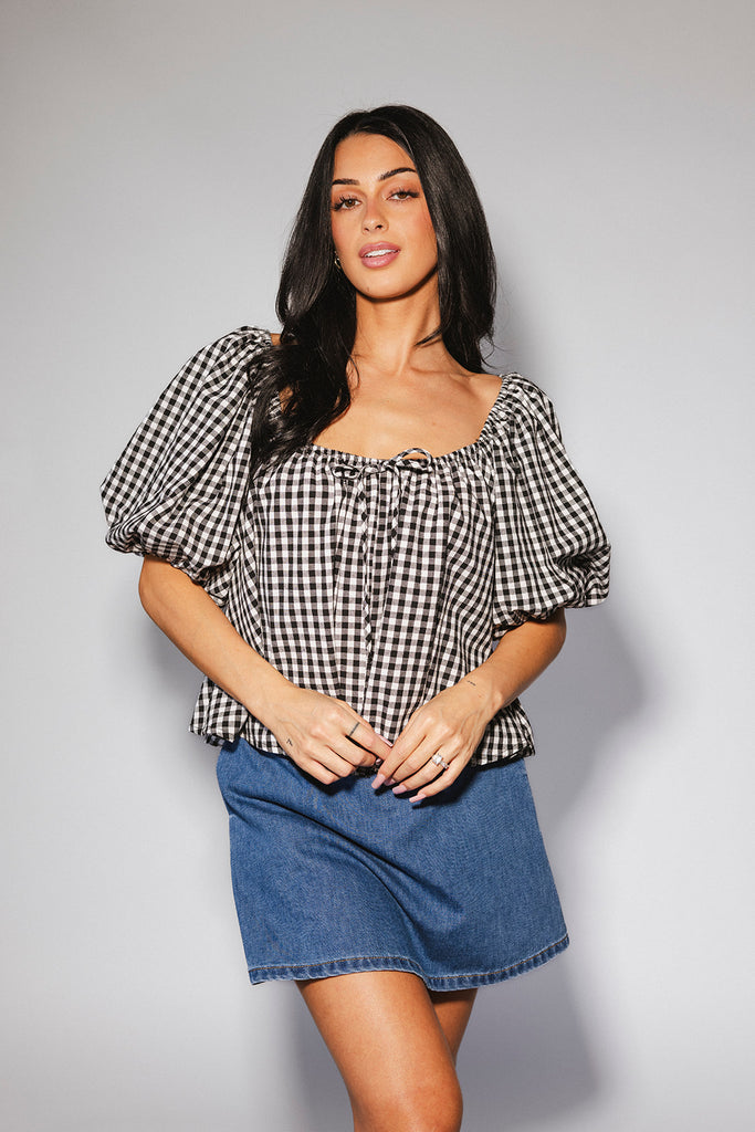 black and white gingham puff sleeve top with an elastic neckline + bow detail. the perfect elevated basic top for date nights + casual outfits. 