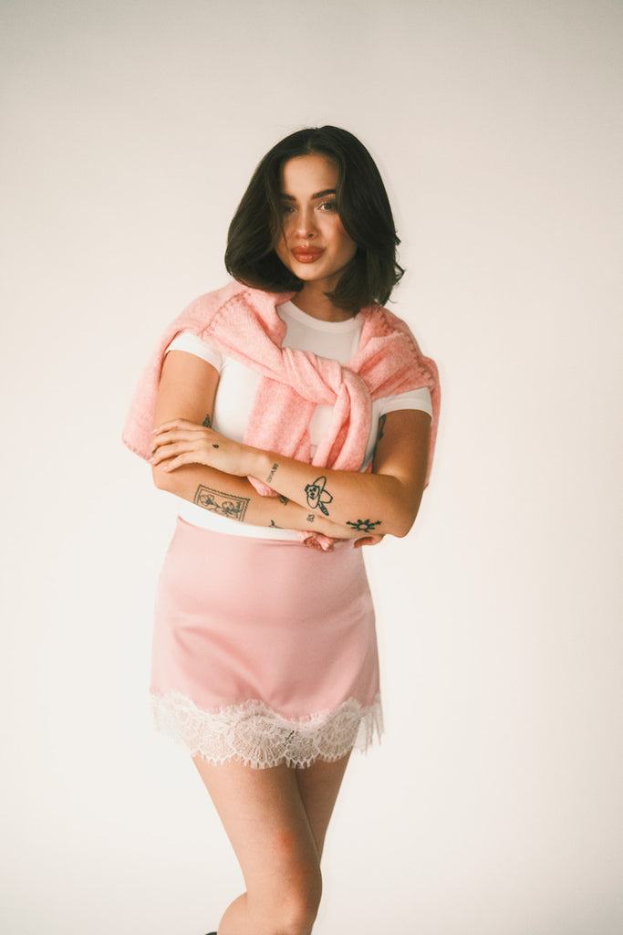 pink satin mini skirt with lace trim. perfect for date night outfits, semi formal outfits, and everyday wear.
