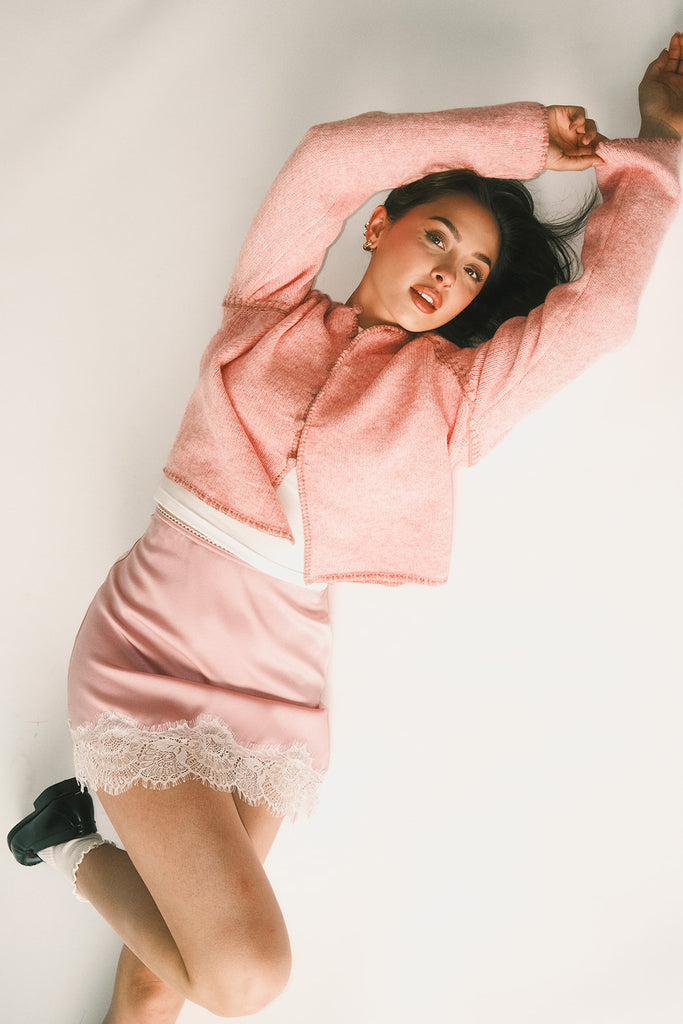 vintage inspired pink cardigan with toggle buttons and an open front. perfect for casual outfits and lightweight layering. 
