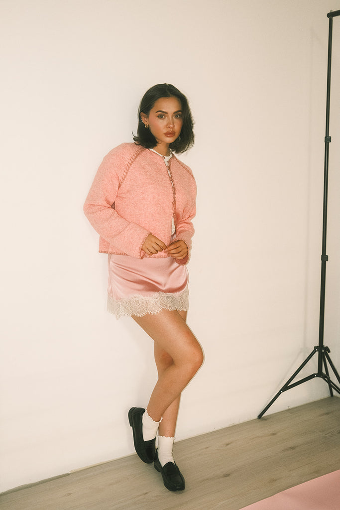 vintage inspired pink cardigan with toggle buttons and an open front. perfect for casual outfits and lightweight layering. 
