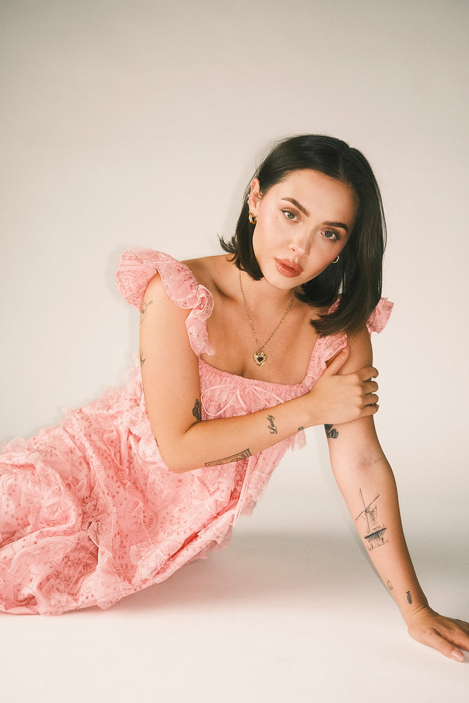 vintage inspired pink lace maxi dress with an elastic neckline and tiered ruffle details. perfect for weddings, bridal showers, and baby showers. 
