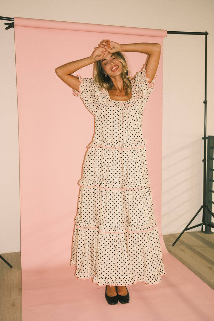 zoco daymaker dress: puff sleeve polka dot dress with an elastic neckline and pink trim details. perfect for weddings, baby showers, and family pictures.