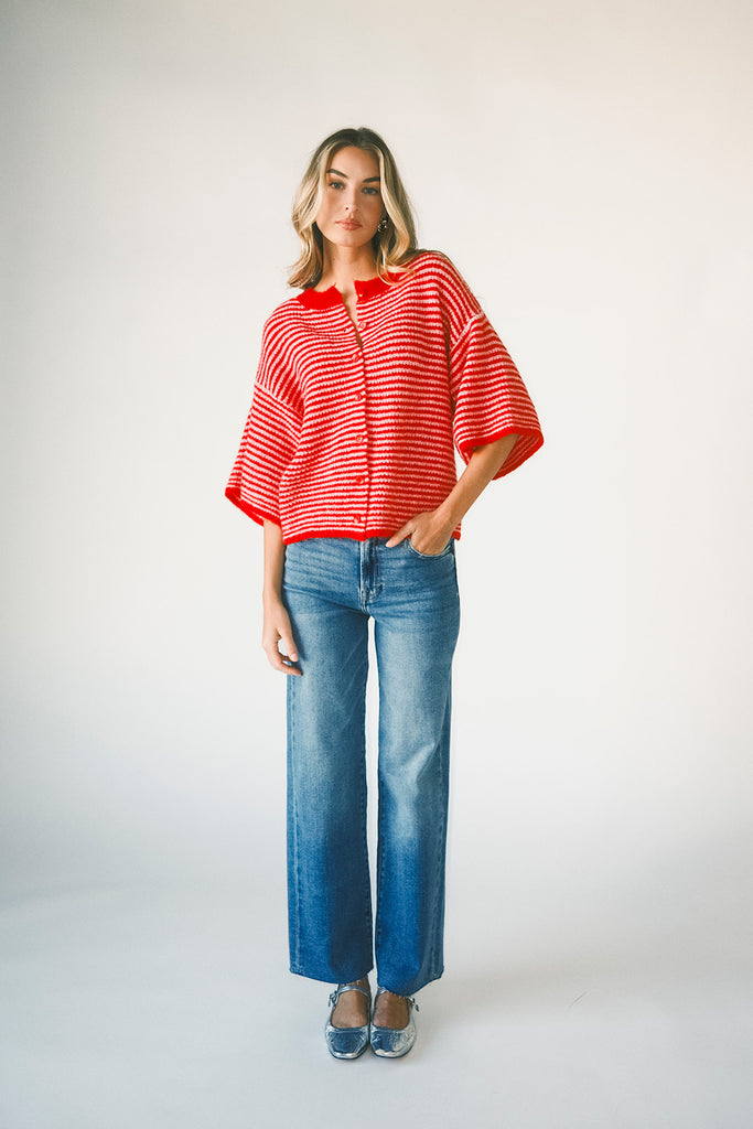 red and pink striped cardigan with short sleeves and a relaxed fit. perfect for casual outfits and lightweight layering. 
