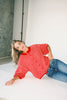red and pink striped cardigan with short sleeves and a relaxed fit. perfect for casual outfits and lightweight layering. 
