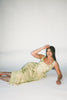 a flowy v-waist green dress with a sleek scoop neckline + subtle floral print. the perfect vintage-inspired maxi dress for weddings, bridal showers, + garden parties.
