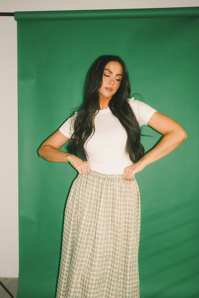 a classic plain white baby tee with a slightly cropped silhouette. the perfect fitted white t-shirt for everyday wear + casual outfit styling.
