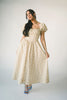 vintage-inspired puff sleeve dress with a muted yellow floral pattern. the perfect puff sleeve midi dress for weddings, bridal showers, + semi-formal events.