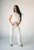 a white denim short sleeve top with a fitted silhouette + a peplum hemline. the perfect denim top to dress up or down for any outfit idea.
