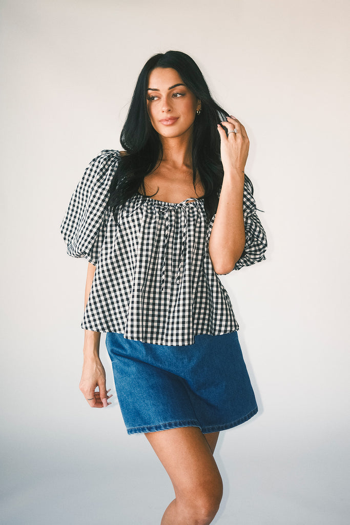 black and white gingham puff sleeve top with an elastic neckline + bow detail. the perfect elevated basic top for date nights + casual outfits. 
