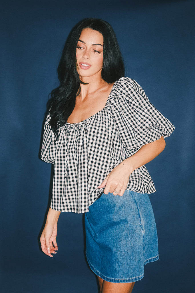 black and white gingham puff sleeve top with an elastic neckline + bow detail. the perfect elevated basic top for date nights + casual outfits. 