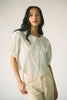a vintage-inspired puff sleeve top with a pastel green pinstripe pattern + an oversized lace trim collar. the perfect elevated button up top for the office, dressy date nights, + everyday wear.

