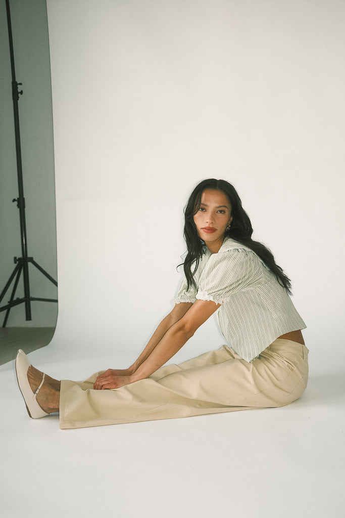 a vintage-inspired puff sleeve top with a pastel green pinstripe pattern + an oversized lace trim collar. the perfect elevated button up top for the office, dressy date nights, + everyday wear.
