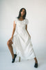 a white vintage-inspired midi dress with a lace ruffle neckline + bow detail. the perfect white dress for bridal showers, rehearsal dinners, + any special occasion.
