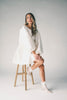 a white satin mini dress with a vintage-inspired silhouette + long balloon sleeves. the perfect little white dress for graduations, bridal showers, + fancy dinner dates.
