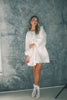 a white satin mini dress with a vintage-inspired silhouette + long balloon sleeves. the perfect little white dress for graduations, bridal showers, + fancy dinner dates.
