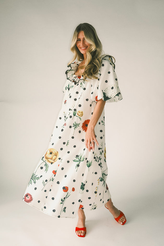 a polka dot puff sleeve dress with floral print details. the perfect polka dot midi dress for baby showers, family pictures, + special occasions. 
