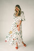 a polka dot puff sleeve dress with floral print details. the perfect polka dot midi dress for baby showers, family pictures, + special occasions. 
