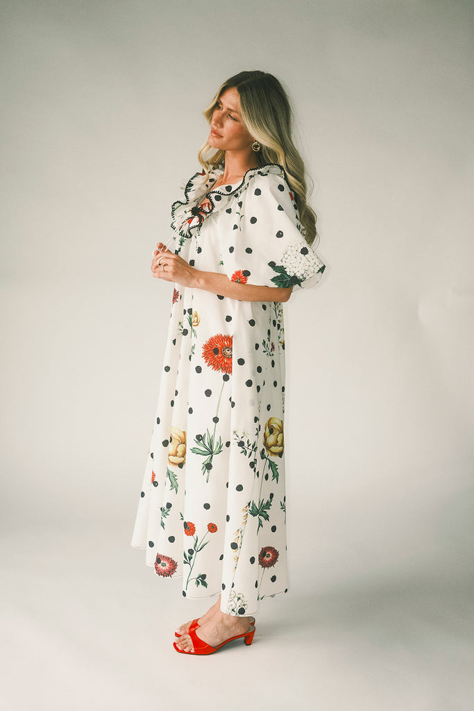 a polka dot puff sleeve dress with floral print details. the perfect polka dot midi dress for baby showers, family pictures, + special occasions. 
