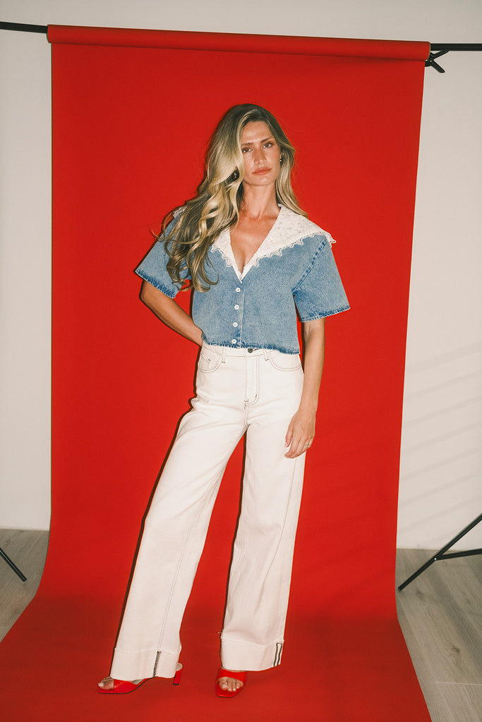 a short sleeve denim top with an oversized lace collar + a cropped silhouette. the perfect button up denim top to dress up or down for any outfit idea.
