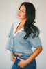 a short sleeve denim top with an oversized lace collar + a cropped silhouette. the perfect button up denim top to dress up or down for any outfit idea.
