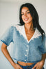 a short sleeve denim top with an oversized lace collar + a cropped silhouette. the perfect button up denim top to dress up or down for any outfit idea.
