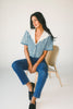 a short sleeve denim top with an oversized lace collar + a cropped silhouette. the perfect button up denim top to dress up or down for any outfit idea.
