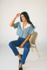 a short sleeve denim top with an oversized lace collar + a cropped silhouette. the perfect button up denim top to dress up or down for any outfit idea.
