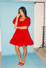 zoco daymaker dress: a short puff sleeve dress with an elastic neckline. the perfect red cotton dress for family pictures, weddings, and baby showers.
