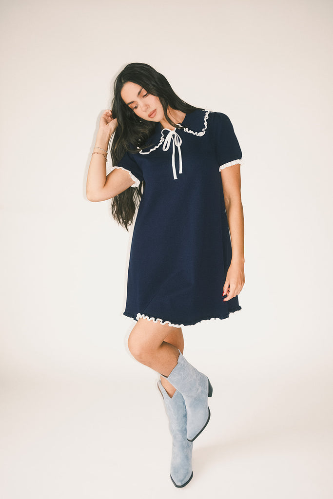 a short sleeve knit mini dress with a ruffled collar + bow detail. the perfect navy knit dress for date nights, family pictures, + everyday wear.
