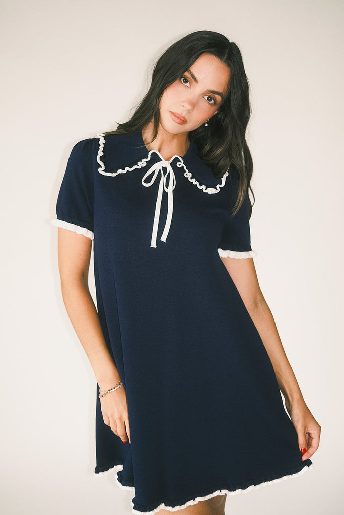 a short sleeve knit mini dress with a ruffled collar + bow detail. the perfect navy knit dress for date nights, family pictures, + everyday wear.
