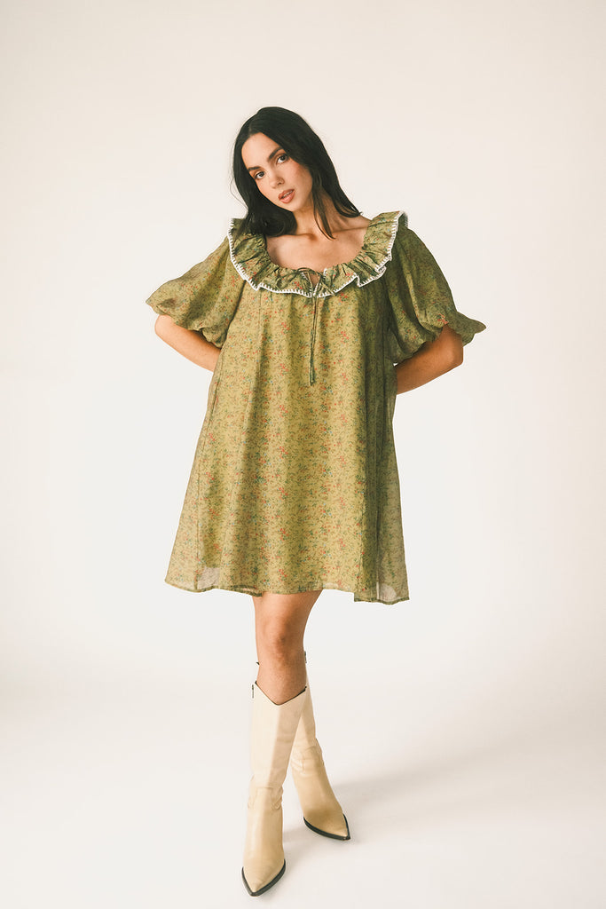a green floral puff sleeve mini dress with a ruffle neckline. the perfect vintage-inspired dress for baby showers, family pictures, + special occasions. 
