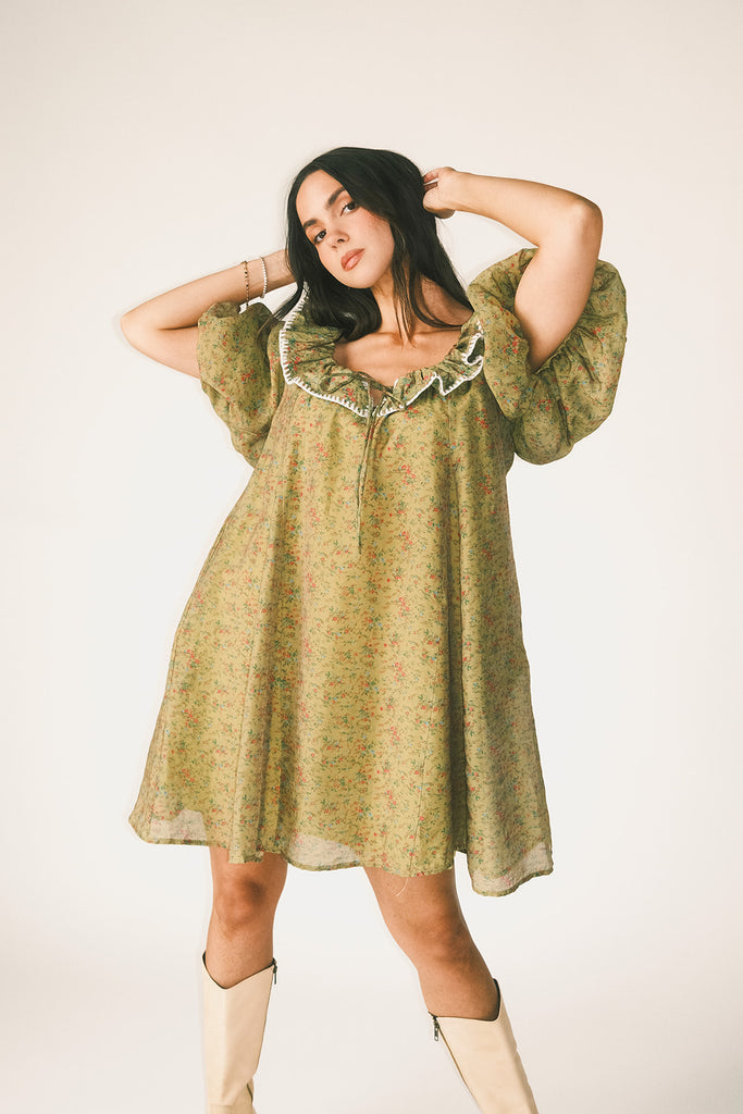 a green floral puff sleeve mini dress with a ruffle neckline. the perfect vintage-inspired dress for baby showers, family pictures, + special occasions. 
