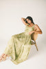 a flowy v-waist green dress with a sleek scoop neckline + subtle floral print. the perfect vintage-inspired maxi dress for weddings, bridal showers, + garden parties.
