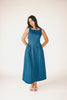 a vintage-inspired denim dress with a boat neckline + a v-shaped waistline. the perfect denim midi dress for family pictures, brunch dates, + special occasions. 
