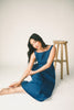 a vintage-inspired denim dress with a boat neckline + a v-shaped waistline. the perfect denim midi dress for family pictures, brunch dates, + special occasions. 

