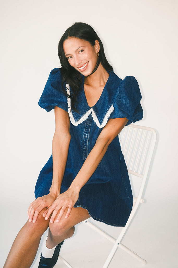 a puff sleeve denim dress with a lace trimmed collar detail. the perfect denim mini dress for date nights, family pictures, + everyday wear.
