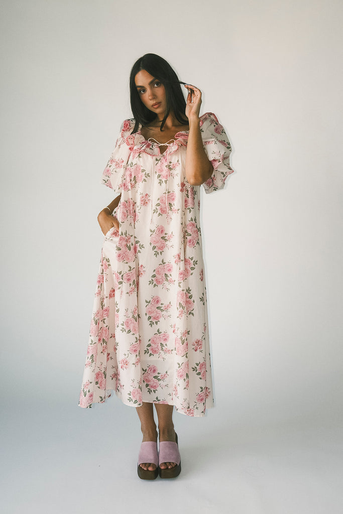 a pink floral puff sleeve dress with a ruffle neckline. the perfect vintage-inspired dress for baby showers, family pictures, + special occasions.
