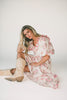 a pink floral puff sleeve dress with a ruffle neckline. the perfect vintage-inspired dress for baby showers, family pictures, + special occasions.
