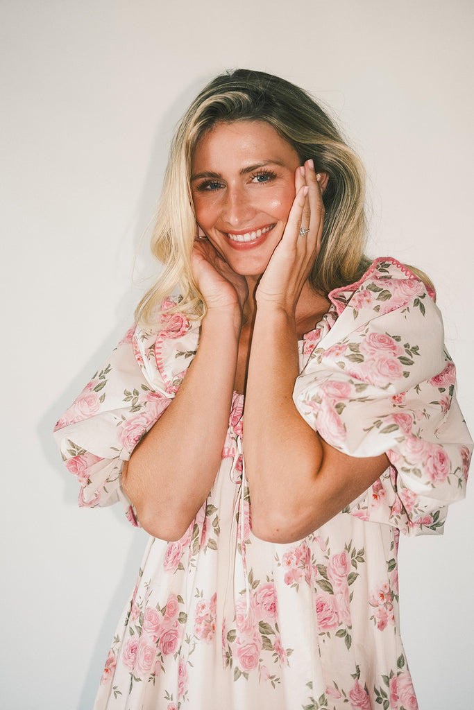 a pink floral puff sleeve dress with a ruffle neckline. the perfect vintage-inspired dress for baby showers, family pictures, + special occasions.
