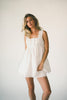 a white tank with a babydoll style silhouette + eyelet details. pair it with the matching white shorts to create the perfect two piece set for brunch dates, vacations, + everyday wear. 