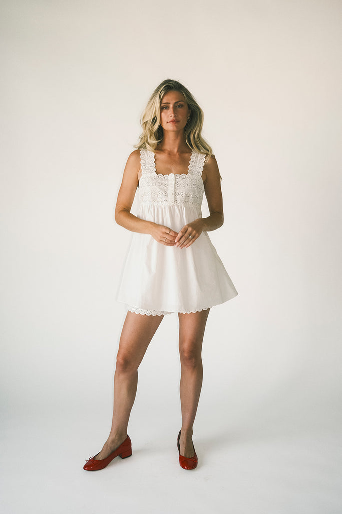 white cotton shorts with eyelet details. pair them with the matching white tank top to create the perfect two piece set for brunch dates, vacations, + everyday wear. 