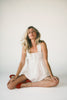 a white tank with a babydoll style silhouette + eyelet details. pair it with the matching white shorts to create the perfect two piece set for brunch dates, vacations, + everyday wear. 
