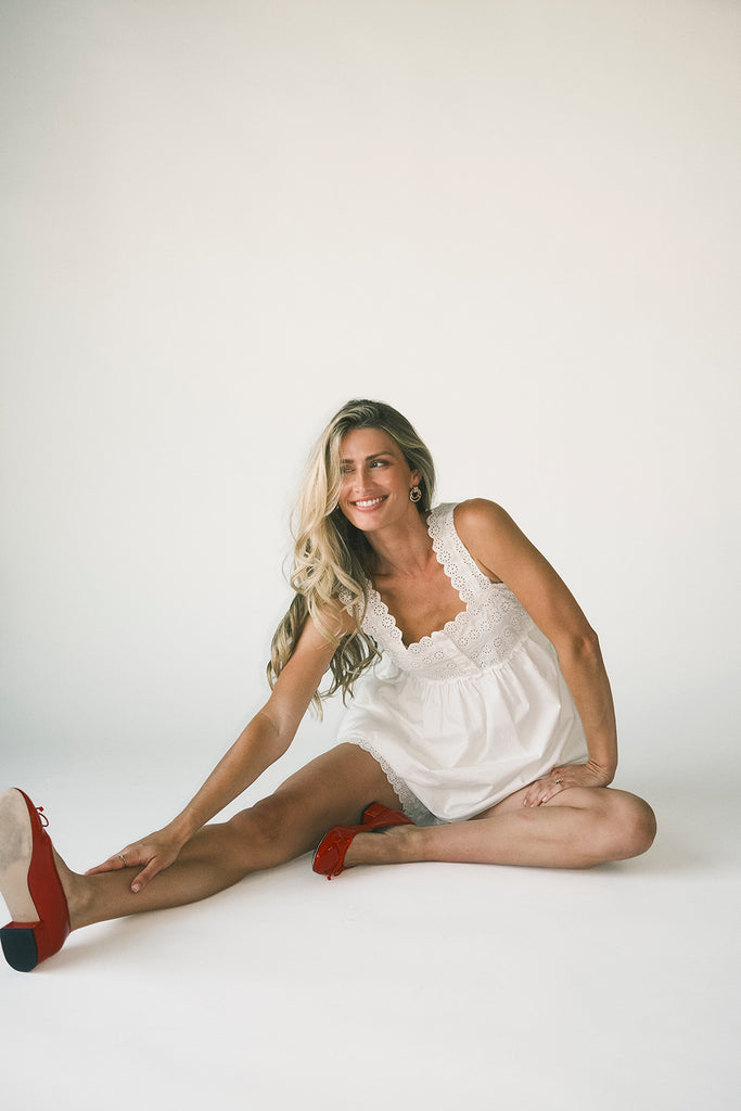 a white tank with a babydoll style silhouette + eyelet details. pair it with the matching white shorts to create the perfect two piece set for brunch dates, vacations, + everyday wear. 